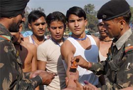 Aspirants getting stamps on thier hands at Army recruitment rally in Bathinda.