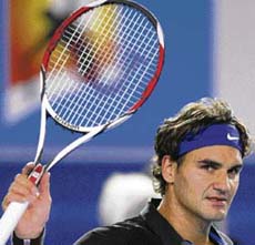 Roger Federer gestures to the crowd after winning against Diego Hartfield at the Australian Open in Melbourne on Tuesday. 