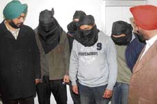 Four accused of kidnapping case being presented before the media in Jalandhar on Wednesday.