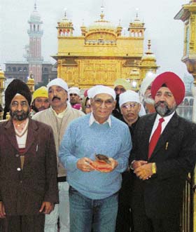 Film director Yash Chopra (centre) at the Golden Temple in Amritsar on Wednesday. 