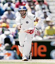 Sachin Tendulkar nudges one over the slips off Brett Lee, while Rahul Dravid plays a straight drive during the third Test against Australia at the WACA ground in Perth