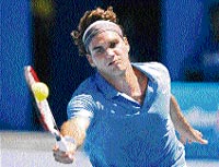 Switzerland�s Roger Federer in action against France�s Fabrice Santoro at the Australian Open