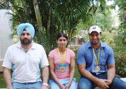 From left: Guide K.P.S Brar, Mandeep Kaur and Om Prakash after winning gold in the All India Inter University Athletics Championship