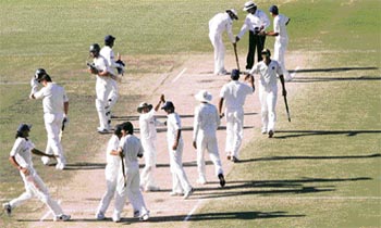 The Indian team celebrates the historic victory over Australia during the fourth day of the Perth Test on Saturday