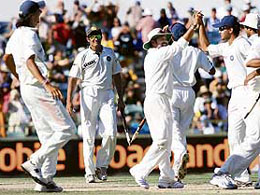 Indian captain Anil Kumble (2nd L) smiles as team celebrates the victory after winning the third Test match between India and Australia at the WACA stadium in Perth on Saturday. Set 413 to win an unprecedented 17th Test in succession, Australia were dismissed for 340 on the fourth day.