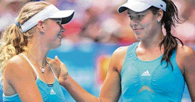 Ana Ivanovic of Serbia (R) is congratulated by opponent Caroline Wozniacki of Denmark after their women's singles fourth round match at the Australian Open tennis tournament in Melbourne on Monday.