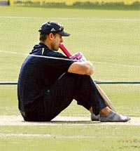 A thoughtful Mathew Hayden sits on the pitch during a training session at Adelaide Oval stadium in Adelaide on Wednesday.