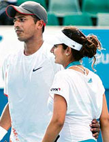 Keeping hopes alive: Sania Mirza and Mahesh Bhupathi embrace after winning their mixed doubles semi-final match against Israel's Andy Ram and France's Nathalie Dechy at the Australian Open in Melbourne. Mirza and Bhupathi won 6-4. 6-2.