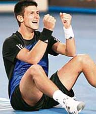 Serbian player Novak Djokovic gestures as he celebrates victory in men�s singles final against French opponent Jo-Wilfried Tsonga at the Australian Open