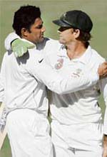 Anil Kumble embraces Australia's retiring wicketkeeper Adam Gilchrist at the end of their fourth Test match at the Adelaide Oval, Australia, Monday.