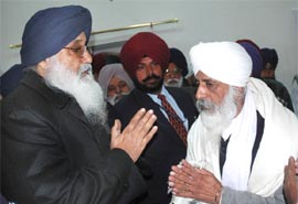 Chief Minister Parkash Singh Badal with Bhai Kahan Singh at Goniana near Bathinda on Tuesday.