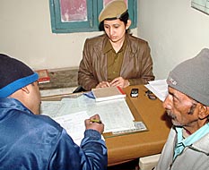 A complainant lodges an FIR himself in a police station as ASI Parmdeep Kaur looks on in Amritsar.