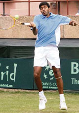 Rohan Bopanna hits a return to Uzbekistan�s Farrukh Dustov on the first day of the Asia-Oceania Group I Davis Cup tie at the R.K. Khanna Stadium in New Delhi on Friday.