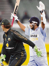 Rohit Sharma raises his arms in triumph at the MCG in Melbourne.