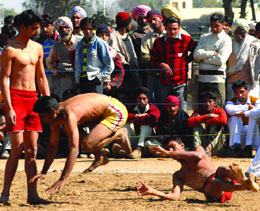 A kabaddi match (57-kg weight category) in progress at the Rural Sports Fest being held at Jethuke village near Bathinda on Tuesday.