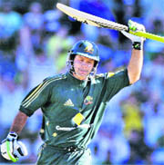 Ricky Ponting raises his bat after scoring a blistering century during the Sydney ODI against India.
