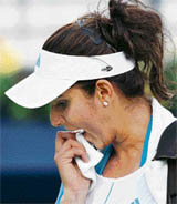 A disappointed Sania Mirza leaves the court after losing to Jelena Jankovic of Serbia in the second round of the Dubai Tennis Championships on Wednesday.
