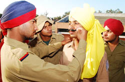 A young artist playing the role of Bhagat Singh gets last minute touch to his get-up from his team-mate just before presenting a skit at the 10th Inter College Youth Festival being held at Government Polytechnic College in Bathinda on Thursday.
