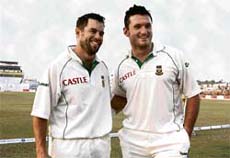 Graeme Smith (right) and Neil McKenzie of South Africa at the end of the first day of the second Test against Bangladesh in Chittagong on Friday. The South African skipper batted superbly for his unbeaten 223 while McKenzie hit 169.