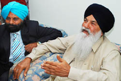 Ajit Singh Kohar (right), state revenue minister, addressing the media persons at Chak Fateh Singh Wala in Bathinda