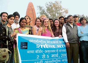 Medical students from 10 countries for a peace march from Attari/Wagah join checkpost to New Delhi pay tributes at Jalianwala Bagh, Amritsar, on Sunday.