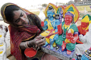 Artist Muli gives final touches to the idols of Lord Shiva and Parvati at a roadside stall in Amritsar ahead of Maha Shivratri, which falls on March 6.
