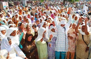 Widows of farmers, who had committed suicide, staging protest outside the DC office in Bathinda on Wednesday. 