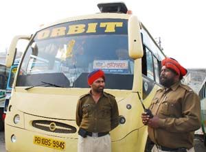 Policemen guarding a Orbit bus at Bathinda bus stand on Friday. 