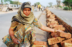 Reconstructing destiny: Paramjit Kaur working on the Bathinda-Barnala bypass on Saturday.