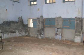Abandoned classrooms with unsafe roofs and cracked walls of Bariwala Primary School