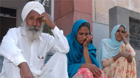 Teja Singh, father, and Jasveer Kaur, victim, outside the CAW cell in Bathinda on Monday.