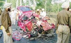 Remains of the car which rammed into a bus near Sohian Khurd village near Amritsar