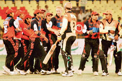 Kolkata Tigers� Nantie Hayward celebrates victory over Mumbai Champs with his team mates after the fall of the Champs� last wicket