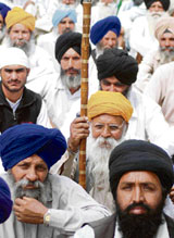 Farmers under the banner of Bharti Kisan Union (Rajewal) sit on a dharna at Jantar Mantar in New Delhi on Thursday.