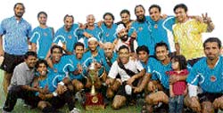 The jubilant Indian Oil Corporation Limited team with the trophy after winning the 5th All India Guru Gobind Singh Gold Cup Hockey Tournament at PAU, Ludhiana, on Thursday. 