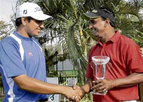 Gaganjeet Bhullar congratulates Mukesh Kumar (right) after he won the Centurian Bank of Punjab Golf Championship at the Chandigarh Golf Club