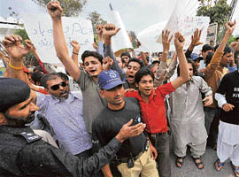 Supporters of Shoaib Akhtar shout anti-Pakistan Cricket Board slogans during a protest in Lahore on Friday.