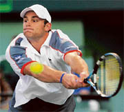 Andy Roddick in action against Roger Federer on Thursday.