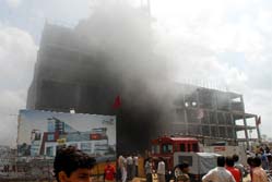 The city mall engulfed in smoke after it caught fire in the Green Avenue area of Bathinda