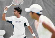 Prakash Amritraj (L) takes part in a practice session