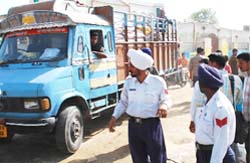 Traffic policemen stop a vehicle as a part of the drive to nab the traffic offenders in Bathinda.