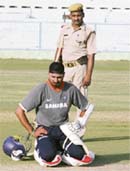 Harbhajan Singh looks at the pitch during a training session ahead of the third and final Test at the Green Park stadium in Kanpur 