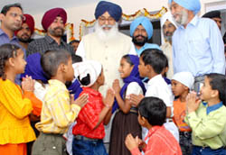 Children from poor families seek CM Parkash Singh Badal�s blessings at Badal village in Muktsar