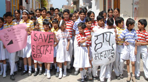 Children from various schools taking out a procession to protest against the hike in price of essential commodities in Bathinda on Thursday.