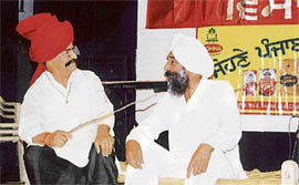 Minister ‘becomes’ nambardar: Punjab transport minister Master Mohan Lal (right) and Jarnail Singh Hoshiarpuri in a play staged at Chandigarh on Wednesday night under the aegis of the International Punjabi Cultural Association.