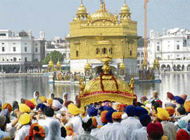 The Palki Sahib is carried to the Golden Temple as part of a nagar kirtan on the eve of parkash divas of Guru Teg Bahadur in Amritsar on Thursday.