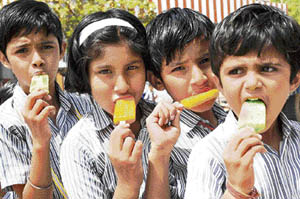 With mercury soaring, children beat the heat with ice candies in Bathinda. 