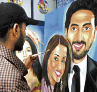 Rubal, class X student and local artist, makes a painting of Bollywood star couple Abhishek Bachchan and Aishwarya Rai Bachchan on their first marriage anniversary in Amritsar 