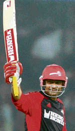 Delhi Daredevils captain Virender Sehwag acknowledges the crowd after completing his half century during their IPL match against Deccan Chargers in Hyderabad on Tuesday. 