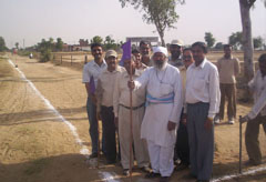 Activists of the Arya Pratinidhi Sabha after taking back the possession of the disputed land in Moga on Friday.